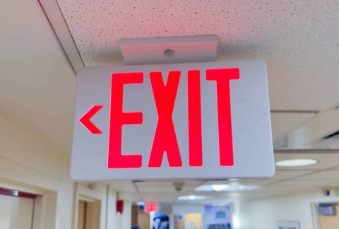 Exit signs: universal symbols of escape and safety, guiding individuals to find their way out in emergencies.